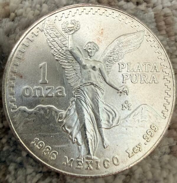 Onza Libertad Gordita 1986 Plata Pura .999 | Mo. Victoria Alada