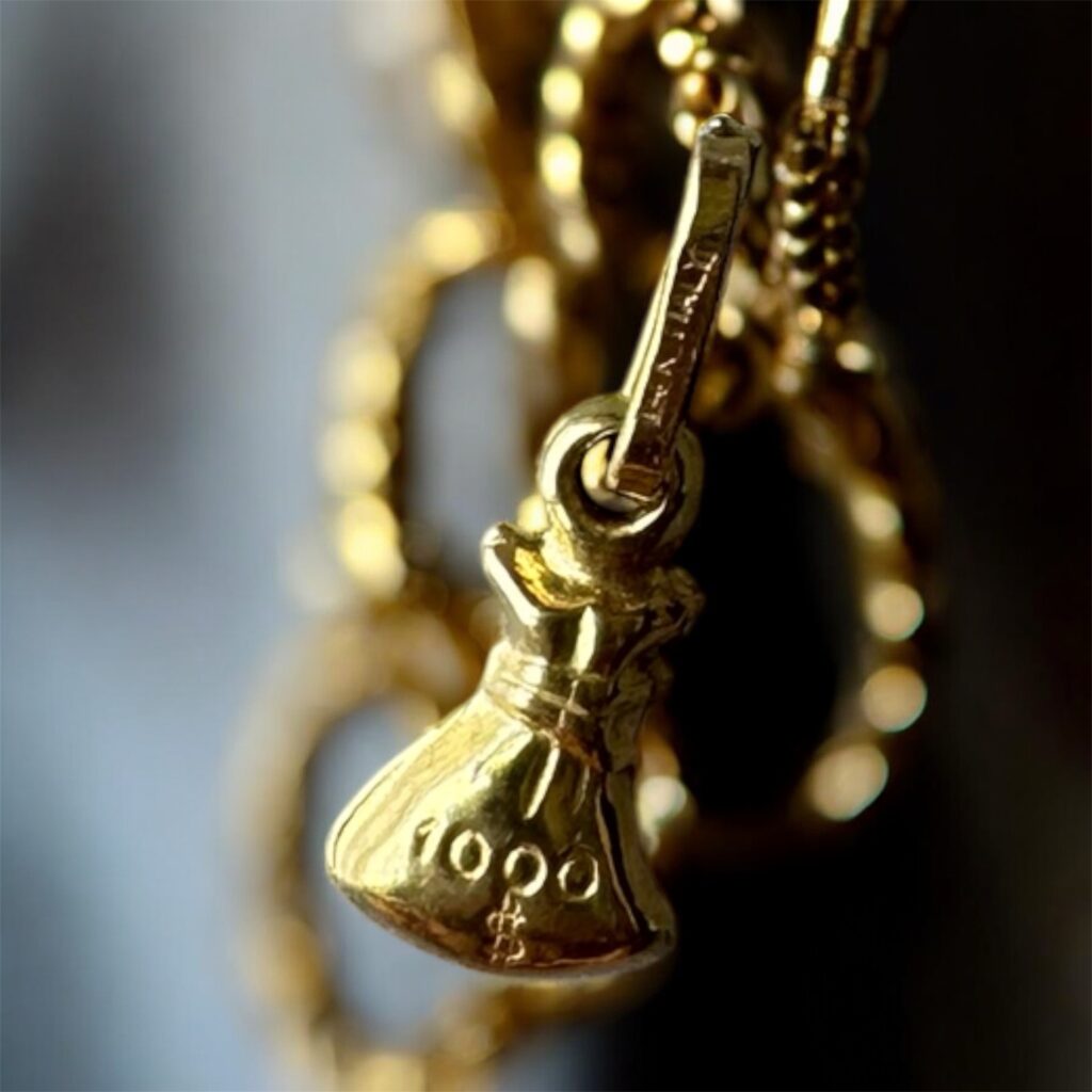 Inicio TodoPrecio.com 17 Charm de Oro 14K Saco de $1000 Dólares